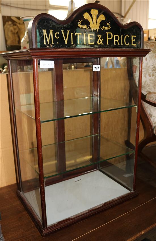 Advertising Mc Vitie & Price glass cabinet